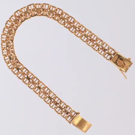 Armband X-länk med stav längd 19,5cm, bredd 9,2mm, en låsåtta saknas, 18K  Vikt: 23,5 g