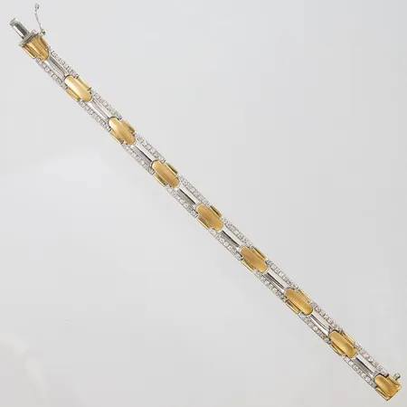 Armband med vita stenar längd ca 17,8cm, bredd 8mm, tvåfärgad, 14K Vikt: 21,4 g