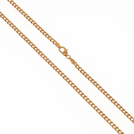 Kedja pansar ihålig modell i 18K guld. Den är 57,5 cm lång, 3 mm bred och väger 5,8g. Karbinhake. Småbucklor, vill vrida sig en aning.