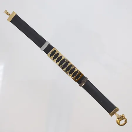 Armband med gulddetaljer och gummi längd 18cm bredd 10-12mm 18K Vikt: 20,8 g