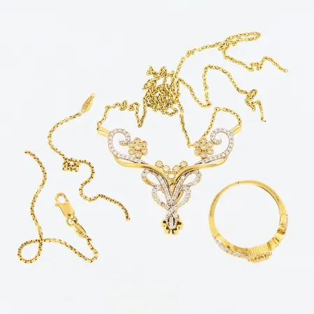 En ring samt ett collier och ett armband,  defekter/saknar stenar, 14K Vikt: 10,1 g