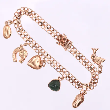 Armband X-länk med 6 st berlocker,Tore Clareus Stockholm,längd ca 18 cm,bredd 6 mm,18k. Vikt: 12,9 g