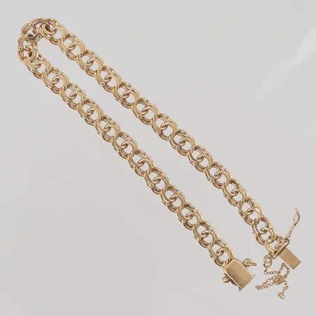 Armband 20cm bredd 6mm slitet lås 18K 11,9g.