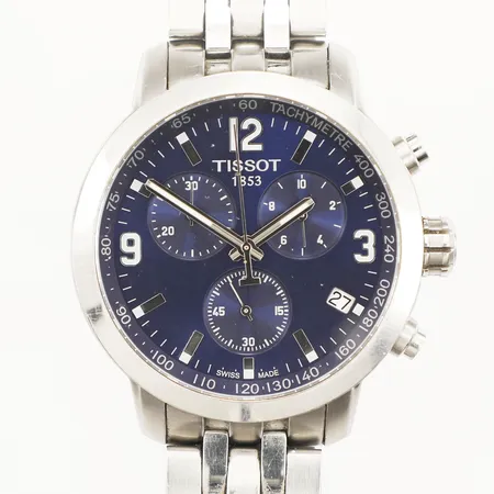 Herrur Tissot, stål, quartz, 42mm, refnr T055417A, serienr 14BC0277036, kronograf, datum, blå urtavla, stållänk ca 15cm, viklås, kronograf återställer ej korrekt, repig, buckla på glasring, inga tillbehör. 