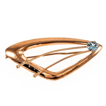 Brosch med en ljusblå sten 45x20mm, krokig nål, slapp i låset, 14K 2,8g.