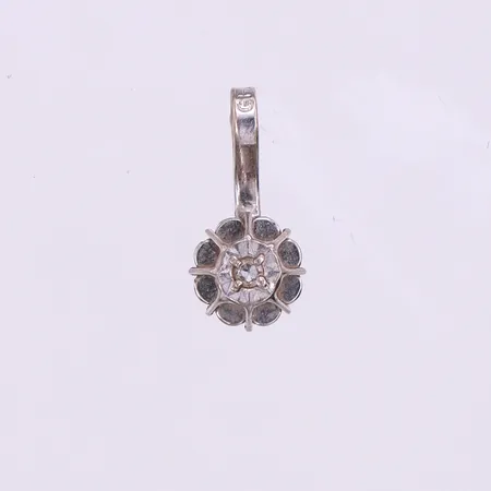 Hänge vitguld med solitär diamant på ca. 0,005ct, höjd med ögla ca 11.2 mm,18k. Vikt: 0,4 g