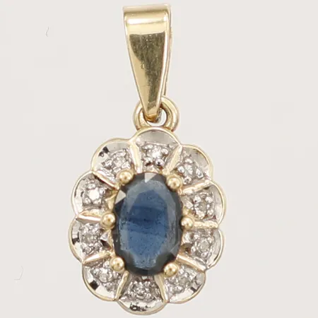 Hänge med blå zirkon samt diamanter ca 10 x 0,005ct Guldfynd, längd 19mm inklusive ögla, bredd 10mm, 18K Vikt: 1,4 g