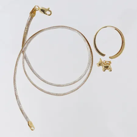 Guldskrot defekt 18K.  Vikt: 17,4 g