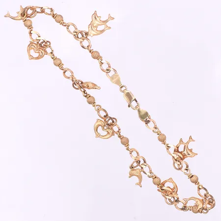 Fotlänk med 9 st berlocker,längd ca 17.5 cm,Carlsén Sundsvall,längd ca 17.5 cm,18k. Vikt: 12,9 g