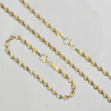 Set med collier tvinnad modell GFAB längd 44½cm och armband längd 19 cm, Ø5 mm, delvis förgyllda med gulguld och rödguld, silver 925/1000. Vikt: 18,1 g