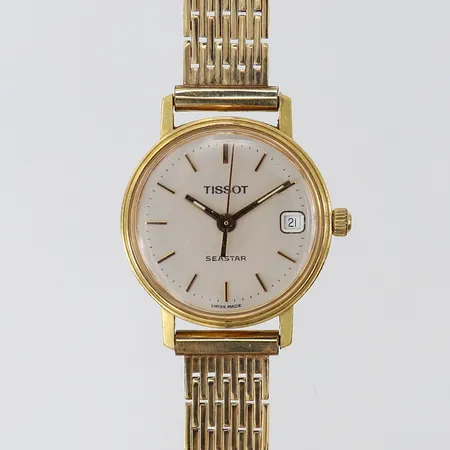 Damur Tissot 18K quartz Ø21,5mm metallarmband längd 17cm gravyr 18K. 