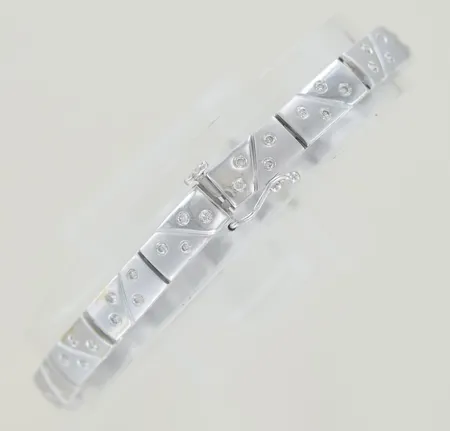 Armband med diamanter 64 x0,01ct, längd 17 cm, bredd 0,5 cm, 18K  Vikt: 14,5 g