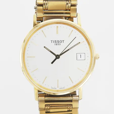 Herrur Tissot 18K quartz med länk i gulmetall, Ø33mm, gravyr, batteribyte behövs, skinnarmband finns med i etui.