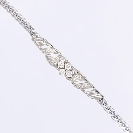 Armband med diamanter totalt 0,25ctv enligt gravyr 18cm bredd 3-7mm vitguld 18K  Vikt: 6,7 g