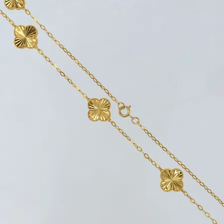 Collier med integrerade hängen fyrklöver, sju stycken fyrklöver, längd 45cm, bredd 2-13mm. 21K OBS, ej märkes designe! Vikt: 12,4 g