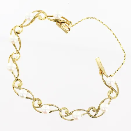 Armband odlade pärlor Ø6mm längd ca 16,5cm bredd 10mm säkerhetskedja, vassa kanter 14K. Bruttovikt: 13,0gram.  Vikt: 13 g