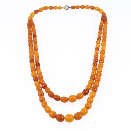 Collier bärnsten doserad delvis 2-radigt 53cm, bredd 5,5-11,5mm, uppträdd på tråd, springring. 