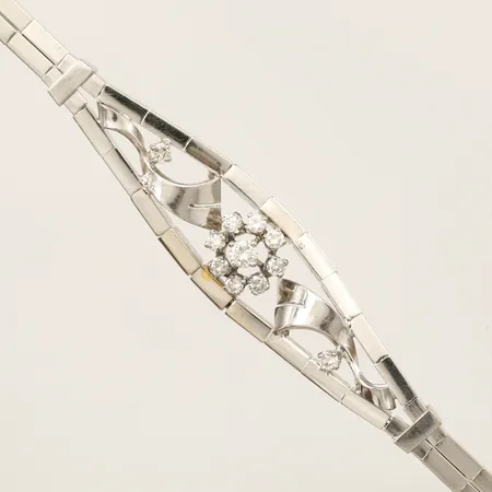 Armband med diamanter 1 x ca 0,10ct & 10 x ca 0,02ct vitguld längd 18,3cm, bredd 12,3mm, något skev, vriden länk, 18K Vikt: 15,9 g