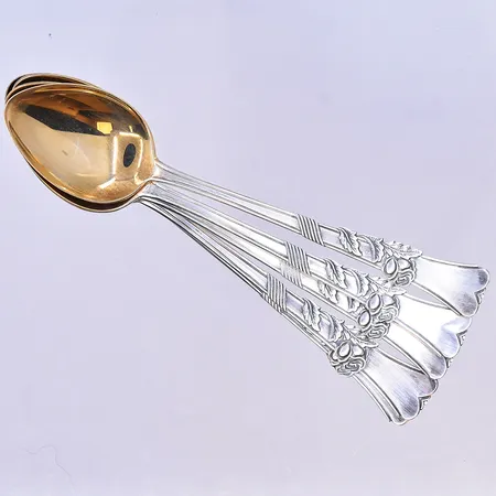 6 skedar längd 11,5 cm, förgylld silver 830/1000.  Vikt: 49,1 g