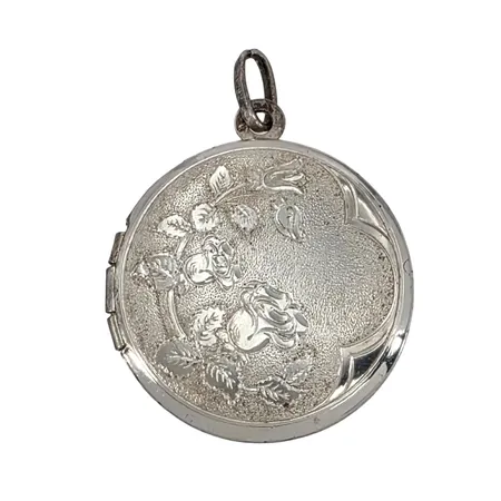 Hänge Medaljong/Fotogömma silver 925/1000, blomdekor, längd inkl. ögla 32,5 mm, bredd 24 mm, komplett med glas/fästen inuti, fint skick Vikt: 6,3 g