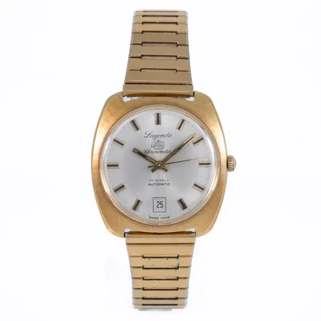 Herrur Lagonda Chronometer 25 jewels i 18K guld. Boett 37,8 x 35,2 mm no 5202. Automat. Datum. Plastglas. Bruttovikt klocka 35,3g. Repor. Nött band i förgylld metall.