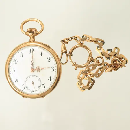 Fickur Ø50mm, 14K i boett, urverk går ej, kronan sitter fast. boettnr: 111558, 88,9g, Klockkedja i gulmetall, längd 26cm.