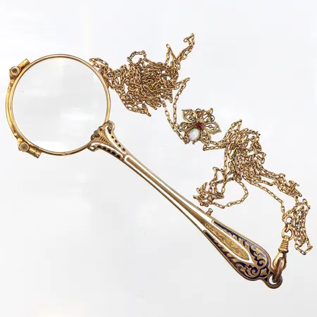 Lornjett,gulmetall med emaljarbeten.