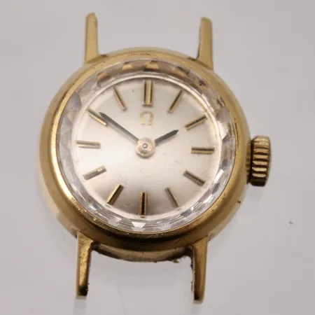 Damur Omega i 18K guld, manuell, Ø17mm, ref:nr 484, serie:nr 86923, inga tillbehör.