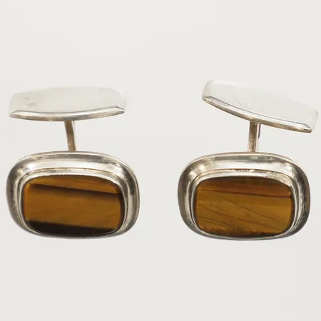 Ett par manschettknappar med tigeröga, 21x 17,2mm, signerad Rusch, 835/1000 silver Vikt: 12,7 g