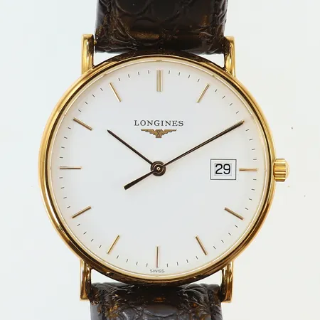 Herrur Longines 18K quartz Ø33mm ref-nr: L4.743.6 serie-nr: 36050222, safirglas, datum, läderband, manual, garantikort 2010, box och ytterkartong, gravyr, går ej. 
