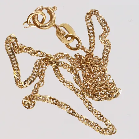 Guldskrot defekt 18K.  Vikt: 1,1 g