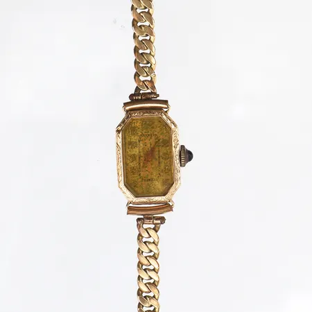 Damur fungerar ej,ca 24x13 mm,14k i uret och metall i bandet.