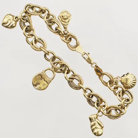 Armband med fem berlocker längd 20cm, bredd ca 8mm, skev låsögla, 18K Vikt: 12,6 g