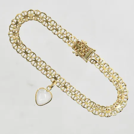 Armband X-länk med stav samt hjärtformad berlock, längd 19cm, bredd 6mm, 18K. Vikt: 8,8 g
