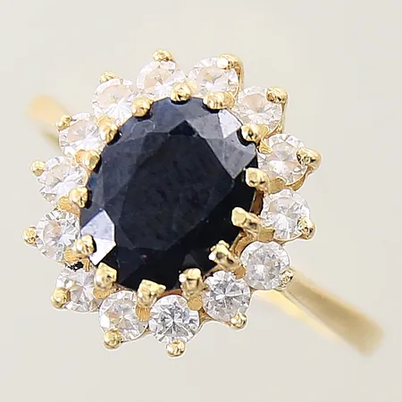 Carmoséring med blå samt vita stenar stl:16½ bredd 1,8-13,6mm 18K Vikt: 4,5 g