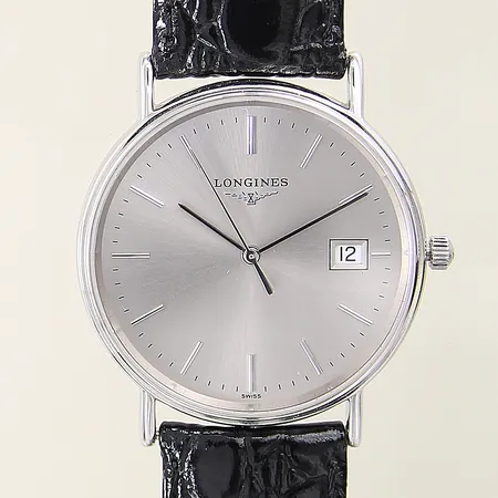 Herrur Longines stål quartz Ø33mm ref-nr L4.720.4 serie-nr 35070255 datum safirglas läderarmband tag manual certifikat ej ifyllt, box, ytterkartong