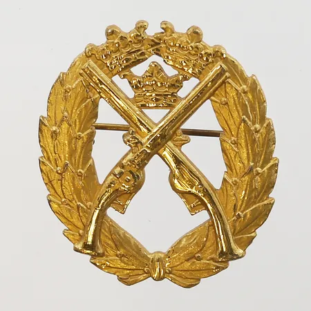 Pistolskyttemärket, valör: Guld, C. Sporrongs Metallfabriksaktiebolag, Stockholm år 1957, förgylld, höjd: 32 mm, bredd: 28 mm, numrerad: 70767, K-grupp, silver. Vikt: 8,3 g