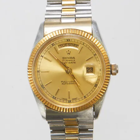 Herrur Sicura Day-Date, automat, stål/doublé, 36mm, boettnr: 9241, doublé länk, slitage, färgbortfall, behov av service, inga tillbehör