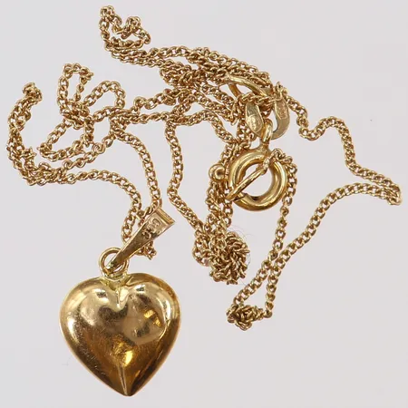 Guldskrot defekt/buckligt knutar 18K.  Vikt: 1,8 g