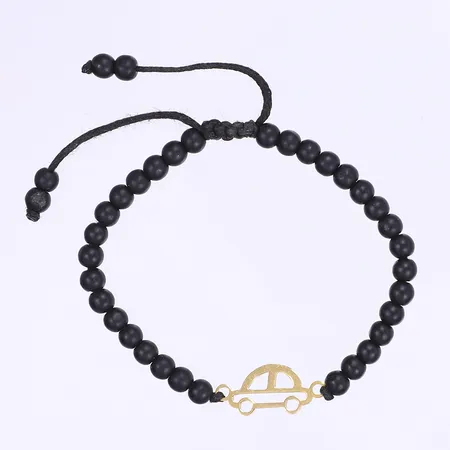 Armband med gulddetaljer och svarta stenar, längd 15-20cm bredd 4mm 18K Vikt: 4,5 g