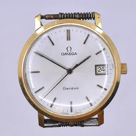 Herrur Omega Genéve Ø34 mm, manuell datum graverad boett 18K.