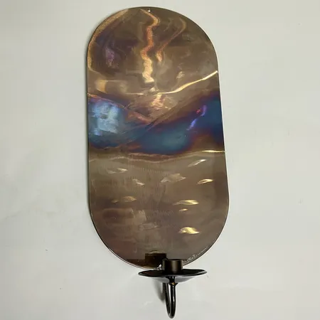 Väggljusstake i metall, design: Birgitta Burman, 45 x 19cm. Skickas med postpaket.