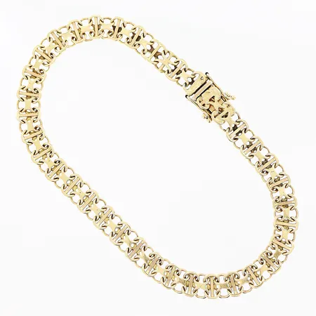 Armband X-länk med stav längd 19,5cm, bredd 6mm, mindre gravyr på baksida lås, något skeva länkbitar, 18K Vikt: 9 g