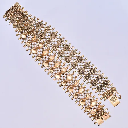 Armband längd 19 cm, bredd 13 mm 18K. Vikt: 21,1 g