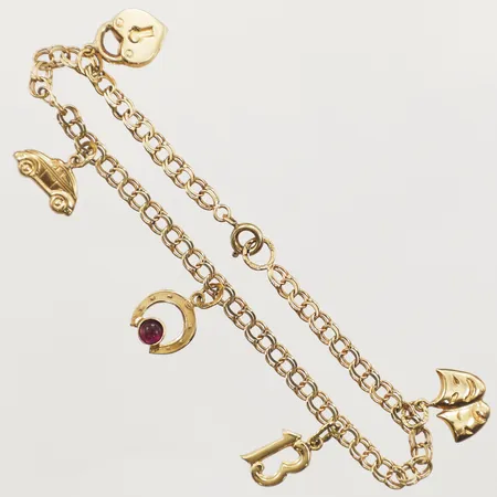 Armband Bismarck med fem berlocker, längd 18cm, bredd 3,5mm, 18K  Vikt: 5,5 g