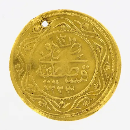 Myntliknande föremål med hål i, Ø27mm, 21K Vikt: 4,2 g