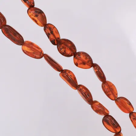 Stencollier med bärnsten på tråd 62cm