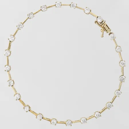 Armband med vita stenar längd 19cm, bredd 1-3mm, 18K Vikt: 8,2 g