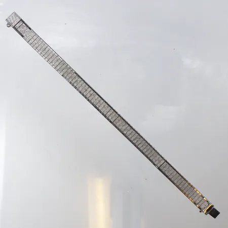 Armband längd ca 18.5 cm,bredd ca 8.7 mm,låsbygel saknas,ojämnheter,silver 835/1000. Vikt: 21,9 g