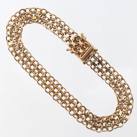 Armband X-länk längd ca 19 cm,bredd ca 8 mm,slitna länkar,18k. Vikt: 14 g